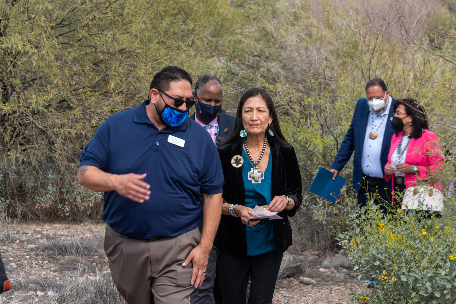 Genaro Ruiz and Deb Haaland, Secretary of the Interior, walk the native plant gardens at the Rio Salado Audubon Center.